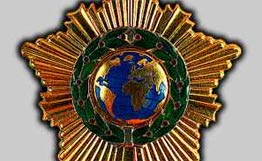 Знак ордена Дружбы.